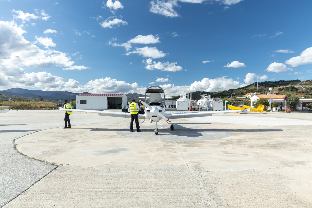Image of pilot doing a pre-flight inspection.